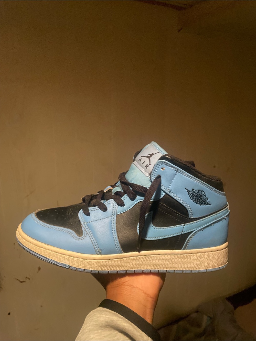 Jordan 1 Mid Sneakers in Black and Light Blue